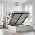 Full view of Arizona wooden ottoman storage bed with mattress platform fully raised revealing entire under-bed storage compartment