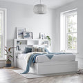 Arizona wooden ottoman storage bed with bookcase headboard styled in a modern bedroom setting