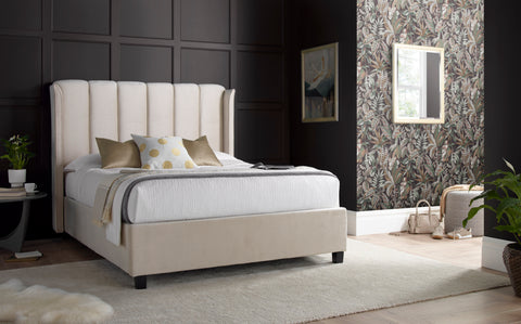 Aurora warmstone velvet ottoman bed with Art Deco winged headboard in a contemporary bedroom setting