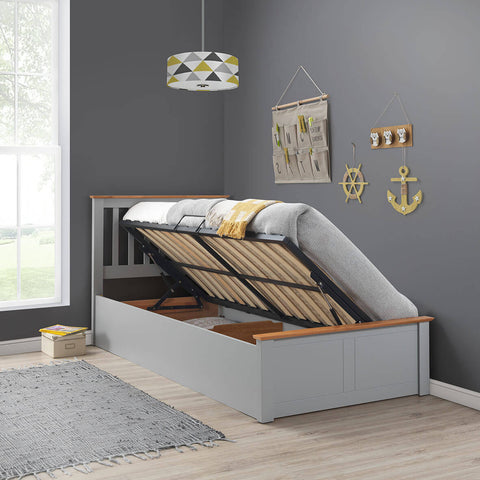 Grey Francis single wooden ottoman bed raised showing under-bed storage in a modern bedroom