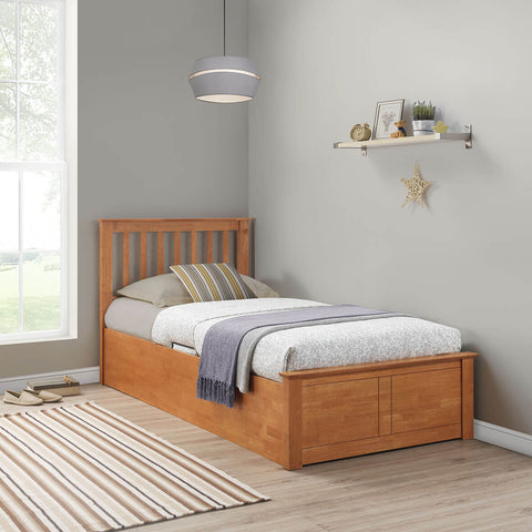 Francis single wooden ottoman bed in natural oak finish styled in a bedroom setting