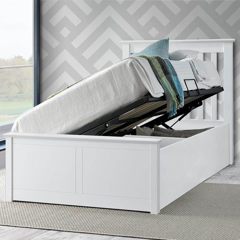 White Francis single wooden ottoman bed raised with gas lift showing open under-bed storage