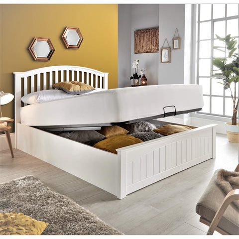 Grayson white wooden ottoman bed with gas-lift base raised showing deep under-bed storage compartments