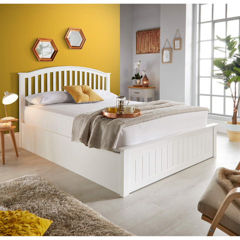 Grayson white wooden storage bed frame with slatted headboard in a modern bedroom setting