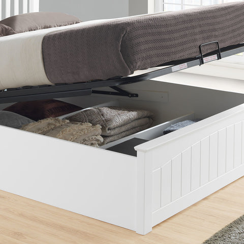 Close-up view of the 27cm deep under-bed storage compartments inside the Grayson white wooden ottoman bed