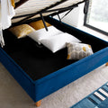 Kingham blue velvet gas-lift ottoman bed lifted open displaying deep under-bed storage space