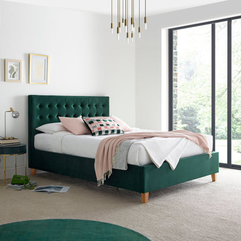 Kingham green velvet ottoman bed styled in a bedroom setting