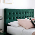 Close-up detail of the contemporary padded headboard on the Kingham green velvet ottoman bed