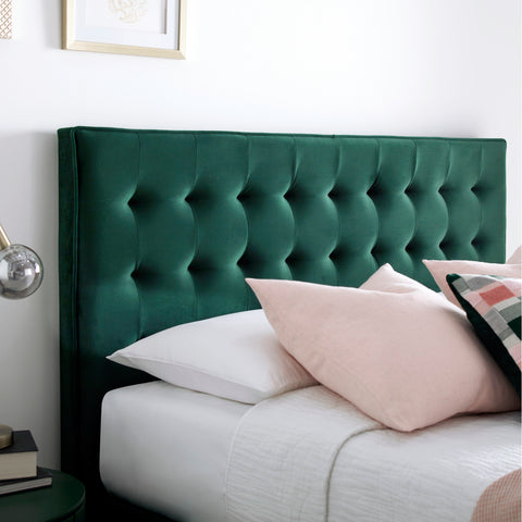 Close-up detail of the contemporary padded headboard on the Kingham green velvet ottoman bed