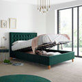 Kingham green velvet gas-lift ottoman bed lifted open displaying deep under-bed storage space