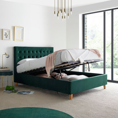 Kingham green velvet gas-lift ottoman bed lifted open displaying deep under-bed storage space