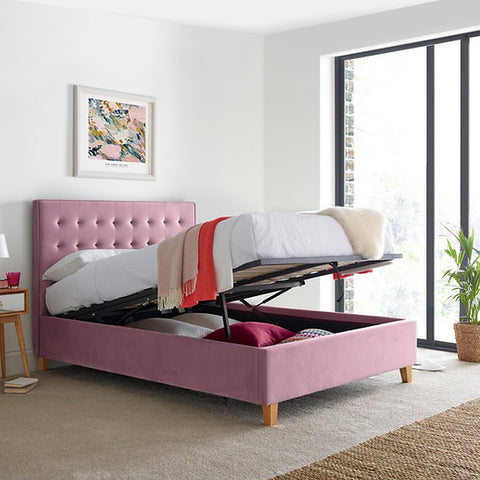 Kingham pink velvet gas-lift ottoman bed lifted open displaying deep under-bed storage space