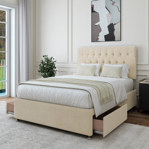 Cream Naples velvet divan bed shown fully assembled in a styled bedroom setting.