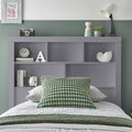 Close up of integrated bookcase headboard shelving on grey Oscar wooden gas lift single bed