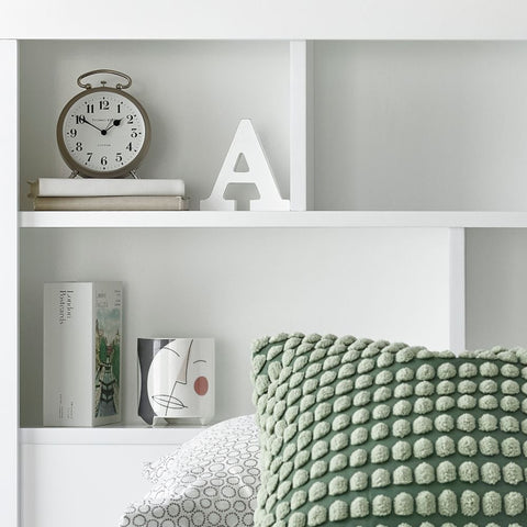 Close up of integrated bookcase headboard shelving on white Oscar wooden gas lift single bed