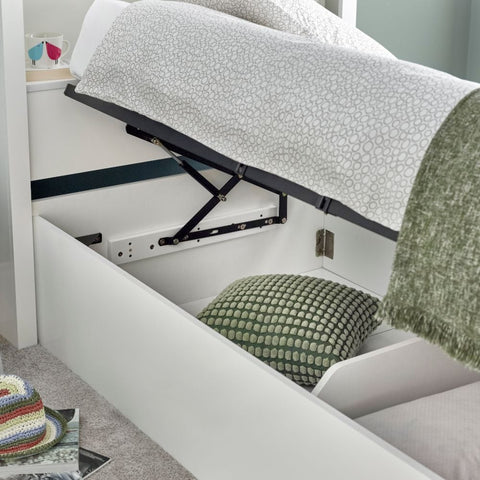 Close up of deep under-bed storage cavity and base on white Oscar wooden gas lift single bed