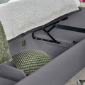 Close up of deep under-bed storage compartment on grey Oscar wooden gas lift single bed