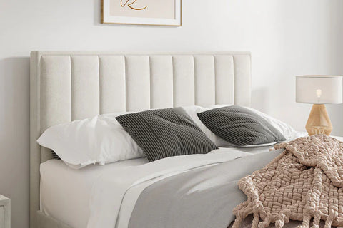 Neatly made Rhodes warmstone velvet ottoman bed with contemporary headboard in a bedroom setting