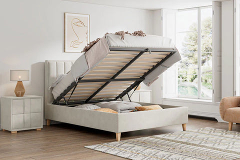 Rhodes warmstone velvet ottoman bed shown open with underbed storage in a bright bedroom setting