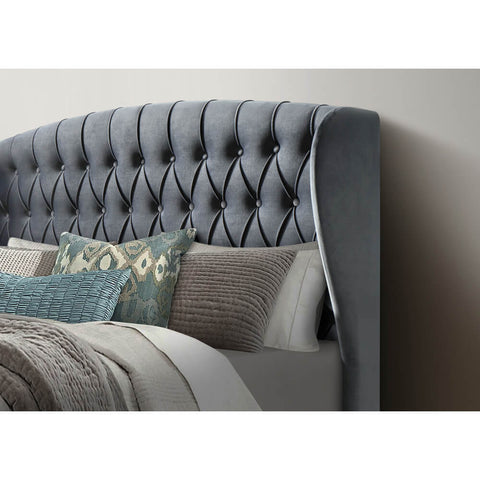 Close-up of 139cm winged button-tufted headboard with 24cm wing depth on Warwick grey velvet ottoman bed