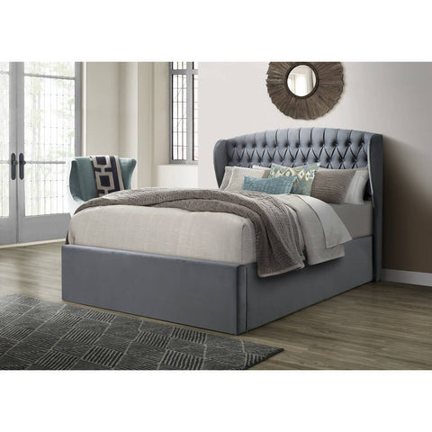 Warwick grey wingback velvet ottoman bed with buttoned headboard styled in a modern master bedroom